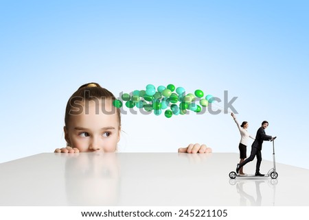 Little cute girl and people with bunch of colorful balloons