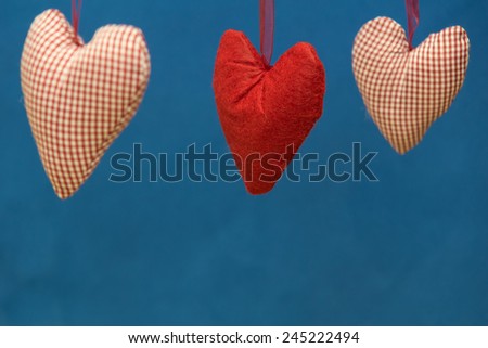 Hearts in front of a blue background