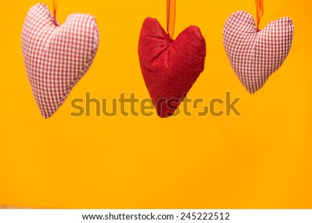 Hearts in front of an orange background
