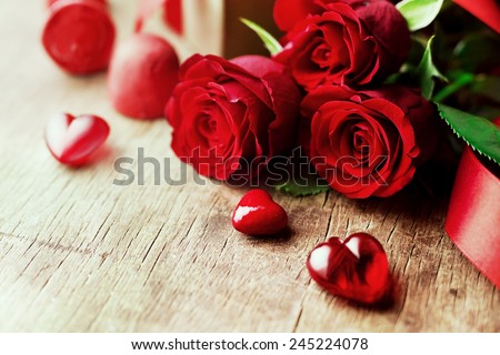 Roses and a hearts on wooden board, Valentines Day background, wedding day Royalty-Free Stock Photo #245224078