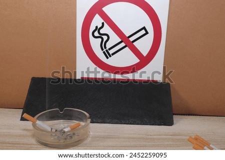 tobacco in the ashtray no smoking sign