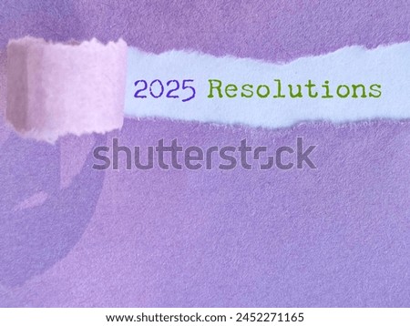 New Year Concept - 2025 resolutions behind torn paper background. Stock photo.