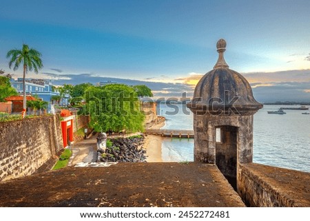 San Juan, Puerto Rico Caribbean coast along Paseo de la Princesa at dusk. Royalty-Free Stock Photo #2452272481