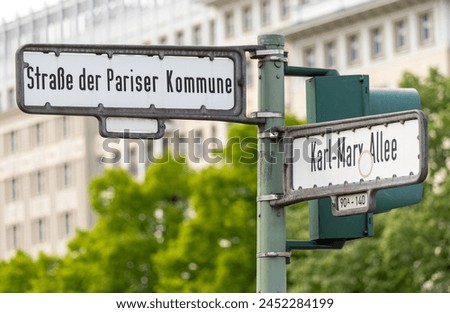Street sign of the Street Straße der Pariser Kommune in Friedrichshain district of Berlin Royalty-Free Stock Photo #2452284199