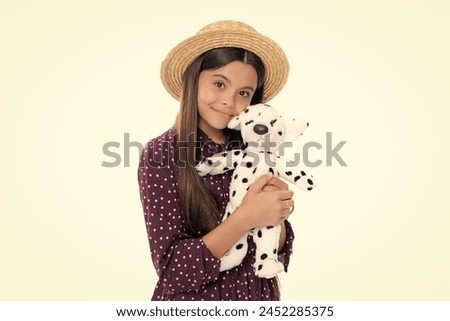 Teen girl in casual clothes hold soft toy for birthday on white background. Kid spending time with her toys. Portrait of happy smiling teenage child girl.