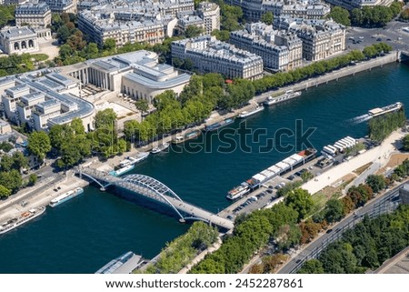 Panoramic view of the roofs of the buildings around the Tour Eiffel and Seine river, Paris, France. Royalty-Free Stock Photo #2452287861