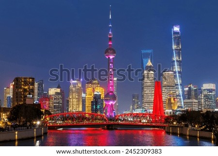 Shanghai skyline at Bund with Oriental Pearl Tower downtown at twilight night in China