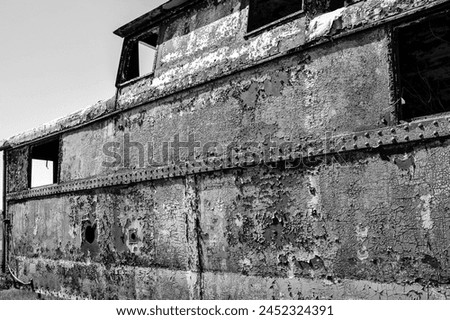 old abandoned rusty metal painted railroad train caboose Royalty-Free Stock Photo #2452324391