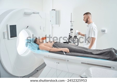 Man doing contrast-enhanced ECG-gated coronary computed tomography