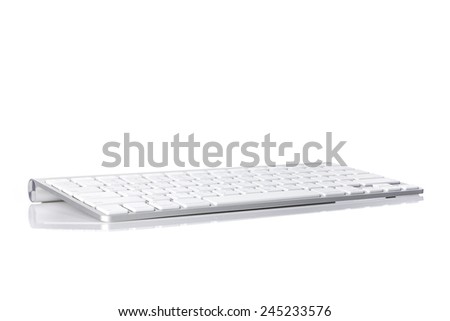 A white(aluminum) keyboard isolated white at the studio. 