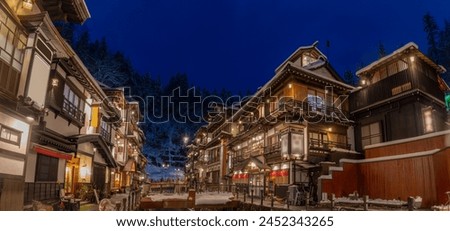 snowy winter evening in Ginzan Onsen, which is a famous hot spring town in Obanazawa, Yamagata, Japan