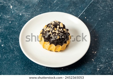 Chocolate Puff Pastry served in plate isolated on background side view of cafe baked food