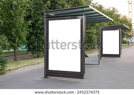 Two Blank Mockups Of Bus Stop Advertising Poster Billboards. White Empty Outdoor Ad Lightboxes On The Sidewalk