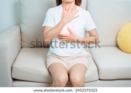 Gastroesophageal Reflux Disease or GERD, Acid reflux disease, Gastro Oesophageal or GORD and Dyspepsia concept. woman having Stomach ache and Esophageal pain due to Digestion system problem Royalty-Free Stock Photo #2452375323