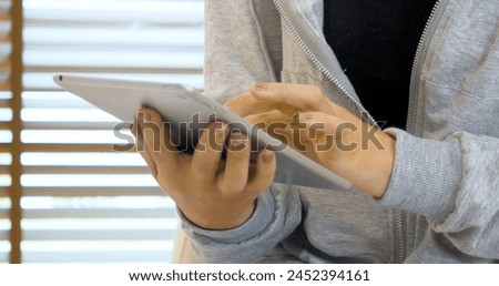 Woman hands using smartphone digital technology tablet empty blank screen. Close up Hands women holding smart tablet touch screen shopping online, call. Woman using mock up mobile at home office