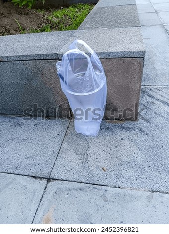 Plastic waste from drinking water that is thrown away carelessly Royalty-Free Stock Photo #2452396821
