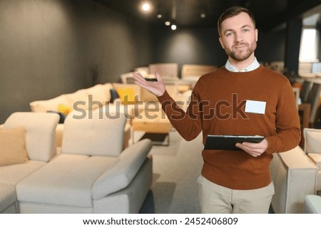 Sales assistant in furniture store.