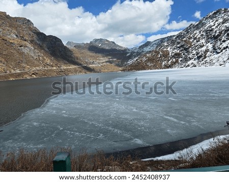 Half frozen lake. Changgu lake of Sikkim Royalty-Free Stock Photo #2452408937