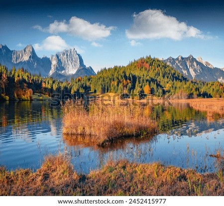 Calm morning view of Wagenbruchsee (Geroldsee) lake with Westliche Karwendelspitze mountain range on background. Impressive autumn scene of Bavarian Alps, Germany. Travel the world.
 Royalty-Free Stock Photo #2452415977