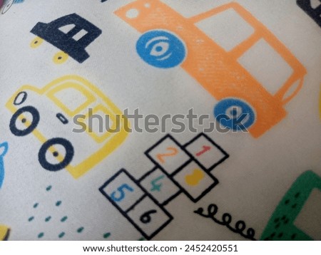 a picture of a cute red and yellow car to place on the fabric
