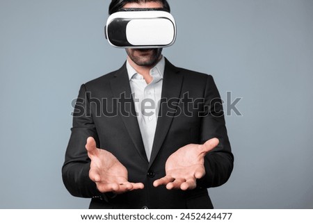 Smart business man with suit holding something while VR goggle to connect metaverse. Professional project manager looking at hologram by using visual reality headset. Technology innovation. Deviation.