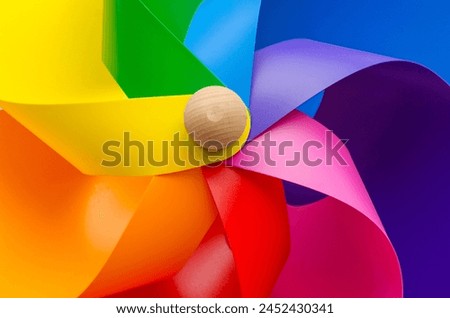 Rainbow colored wind wheel, Alicante City, Costa Blanca, Spain - stock photo