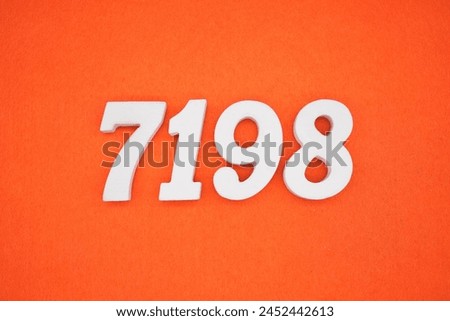 Orange felt is the background. The numbers 7198 are made from white painted wood.