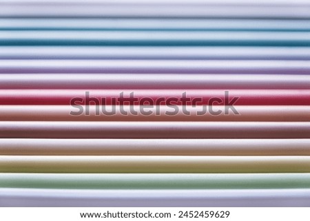 set of pastel colored colorful pencils , colorful background Royalty-Free Stock Photo #2452459629