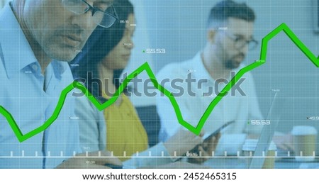 Image of graph and changing numbers over diverse coworkers preparing reports in office. Digital composite, multiple exposure, business, profit, growth, planning and technology concept.