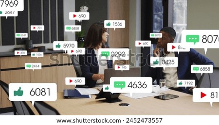 Image of notification bars over diverse coworkers discussing report on laptop in office. Digital composite, multiple exposure, business, teamwork, planning, social media reminder and technology.