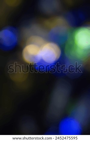 Defocused neon light. Overlaying highlights. Futuristic abstract LED illumination. Neon colors blur on dark abstract background