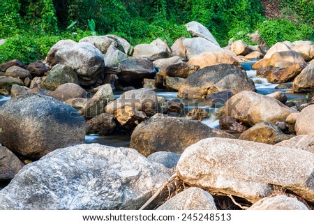 Nature small waterfall with rock in Thailand