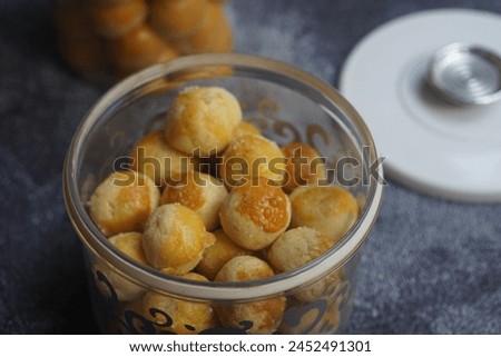Nastar Cookies, Pineapple tarts or nanas tart are small, bite-size pastries filled or topped with pineapple jam, commonly found when Hari Raya or Eid Al Fitr or Lebaran. Selective focus. Royalty-Free Stock Photo #2452491301