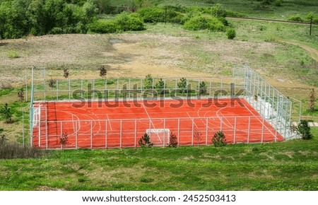 Empty Sports Field For Outdoor Sports Activities fenced