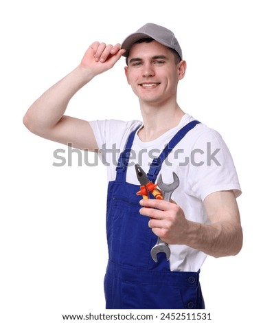 Young man holding pliers on white background
