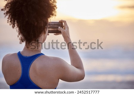 Phone screen, photography and woman with beach sunset for travel, memory or running fitness break. Sunrise, back and runner smartphone for social media, blog and profile picture at sea for training