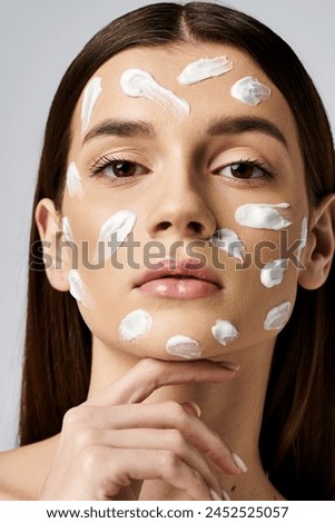 A young woman with a generous amount of cream on her face, enhancing her skincare routine.