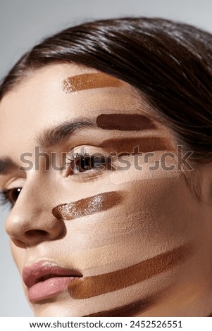 A beautiful young woman posing with foundation enhancing her features.
