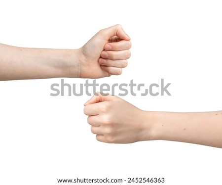 Two hands, white background, fist bump. Team power bro greeting, together in friendship, partnership gesture. Human female and male arms, concept of nonverbal communication, symbol of unity.