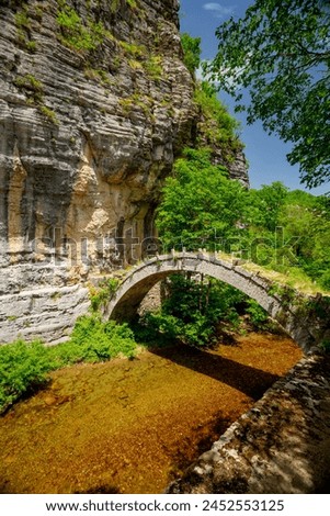 Zagorohoria stone bridge, Greece. Lazaridi arch bridge	 Royalty-Free Stock Photo #2452553125