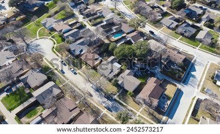 Multiple cul-de-sac dead-end street that shapes like keyholes in suburban residential neighborhood outside Dallas, Texas, aerial view subdivision single family houses with swimming pools backyard. USA
