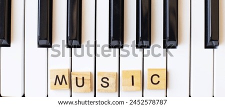 Synthesizer keys black and white background with copy space for your text. Piano octave close up Royalty-Free Stock Photo #2452578787