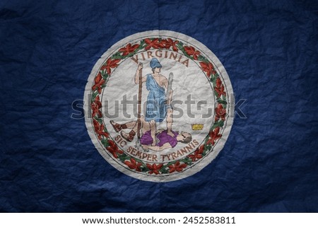colorful big national flag of virginia state on a grunge old paper texture background