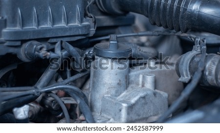 Close up view of engine oil filler hole in the car engine room Royalty-Free Stock Photo #2452587999