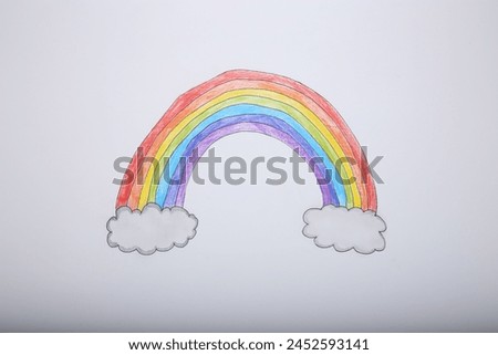Rainbow and clouds drawn on white background