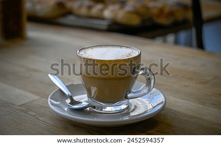 Isolated high resolution large of a single steaming hot coffee cup preparation- cappuccino in a restaurant- Israel