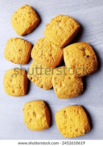 Pistachio biscuits at the table of bakery. Advertising poster of biscuits are on discount or for sale. 