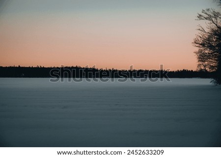 Frozen river with a beautiful sunset
