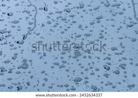 Drops of melted snow - water on the window of a car 4