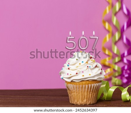 Birthday Cake With Candles Number 507 - Photo On Pink Background.